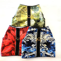 Three colorful patterned dog harness rain proof stacked on a white background