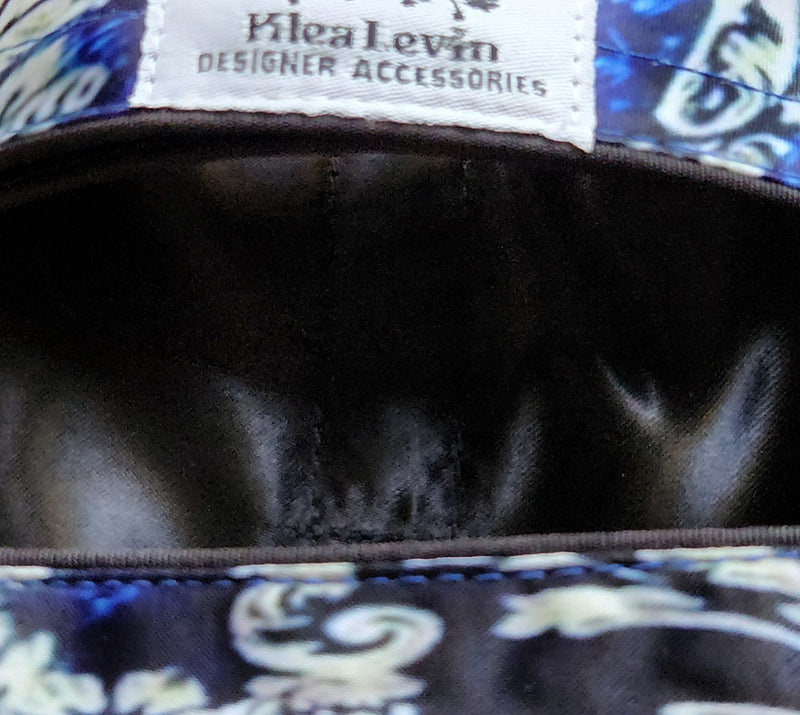 Close-up of a bag with a visible brand label on a patterned background